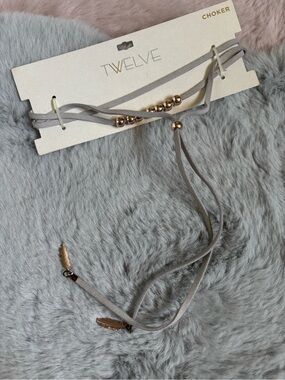 Twelve light gray suede wrap layered beaded choker